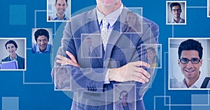 Composite image of portrait of smiling businessman standing hands folded