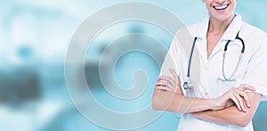 Composite image of portrait of smiling female doctor standing arms crossed