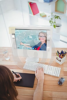 Composite image of portrait of smiling teacher pointing at blackboard