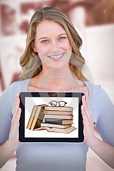 Composite image of portrait of smiling woman with tablet