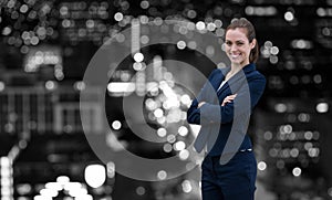 Composite image of portrait of smiling young businesswoman arms crossed