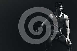 Composite image of portrait of sportsman practising discus throw