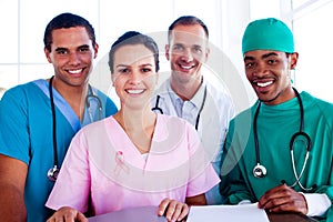 Composite image of portrait of a successful medical team at work