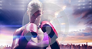 Composite image of portrait of woman fighter with gloves