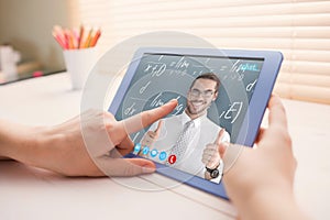 Composite image of positive businessman posing with thumbs up