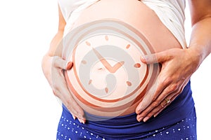 Composite image of pregnant woman holding her bump