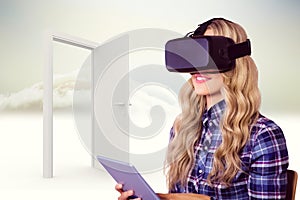 Composite image of pretty casual worker using oculus rift