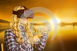 Composite image of pretty casual worker using oculus rift photo