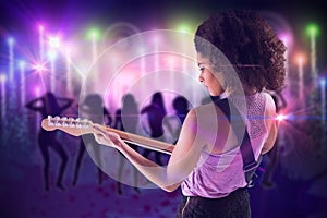 Composite image of pretty girl playing guitar