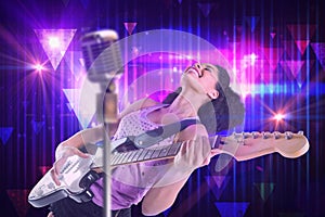 Composite image of pretty girl playing guitar