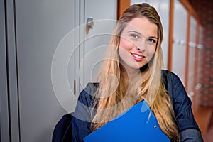 Composite image of pretty student in the library