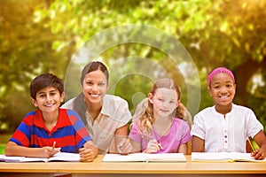 Composite image of pretty teacher helping pupils in library