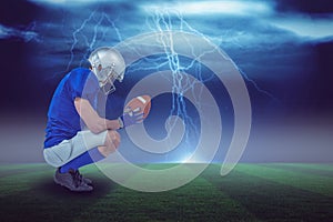 Composite image of profile view of american football player in attack stance 3d