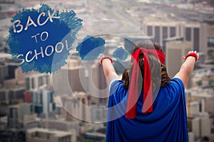 Composite image of rear view boy with arms raised