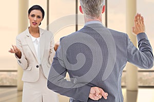 Composite image of rear view of businessman taking oath with fingers crossed