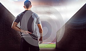 Composite image of rear view of rugby player with fingers crossed