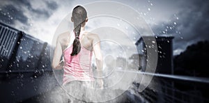 Composite image of rear view of woman running against white background