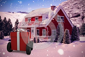 Composite image of red gift box on wheels