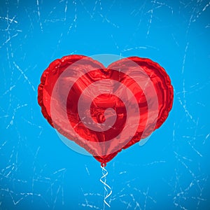 Composite image of red heart balloon