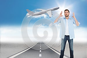 Composite image of reproachful man looking up