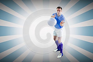 Composite image of rugby player catching a rugby ball