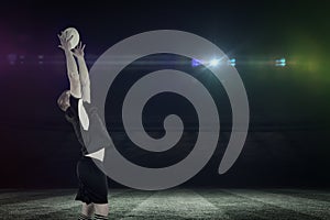 Composite image of rugby player catching a rugby ball