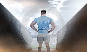 Composite image of rugby player with hands on hips