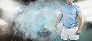 Composite image of rugby player looking at camera