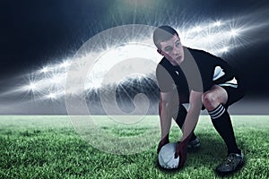 Composite image of rugby player about to throw a rugby ball and 3d