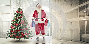 Composite image of santa carries some christmas bags