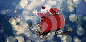 Composite image of santa claus riding on sled with gift box