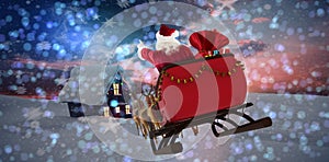 Composite image of santa claus riding on sled with gift box