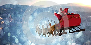 Composite image of santa claus riding on sleigh with gift box