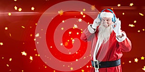 Composite image of santa claus showing hand okay sign while listening to music on headphones