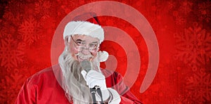 Composite image of santa claus singing christmas song