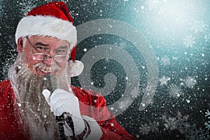 Composite image of santa claus singing christmas song