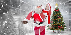 Composite image of santa and mrs claus smiling at camera