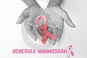 Composite image of schedule mammogram text with breast cancer awareness ribbon