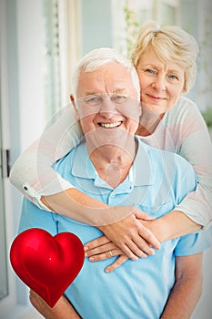 Composite image of senior couple and valentines hearts 3d