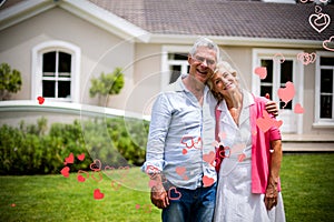 Composite image of senior couple and valentines hearts 3d