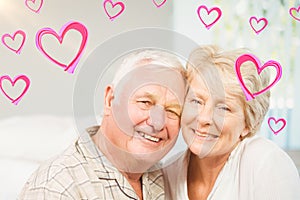 Composite image of senior couple and valentines hearts 3d