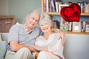 Composite image of senior couple and valentines hearts 3d