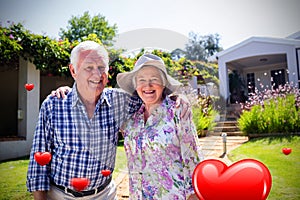 Composite image of senior couple and valentines hearts 3d