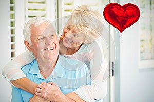 Composite image of senior couple and valentines hearts 3d