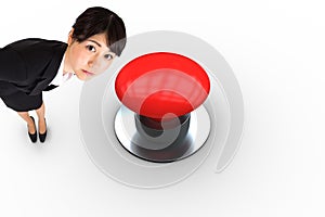 Composite image of serious businesswoman bending