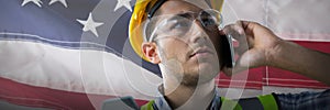 Composite image of serious construction worker on the phone