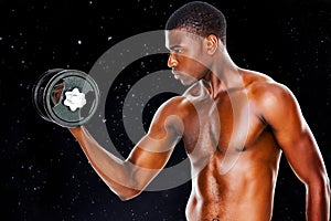 Composite image of serious fit shirtless young man lifting dumbbell