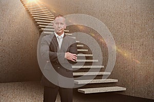 Composite image of serious manager with arms crossed in warehouse 3d