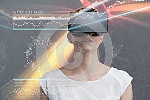 Composite image of serious woman using virtual reality simulator