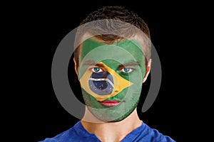 Composite image of serious young brasil fan with facepaint